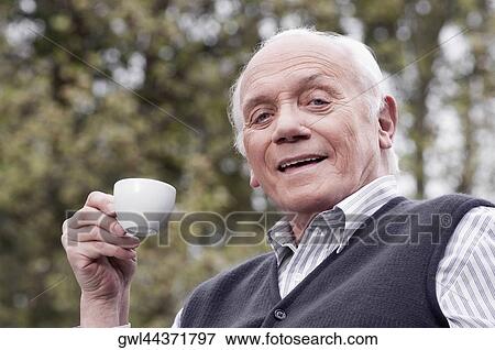 Portrait of a man drinking tea View Large Photo Image Stock Photo - Portrait of a man drinking tea. Fotosearch