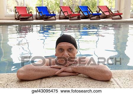 Portrait of a man in a swimming pool View Large Photo Image Stock Photography - Portrait of a man in a swimming pool. Fotosearch
