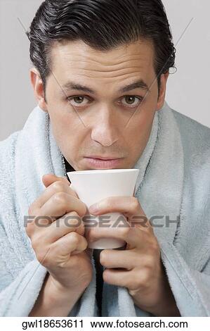 Portrait of a man taking hot drink View Large Photo Image Stock Image - Portrait of a man taking hot drink. Fotosearch