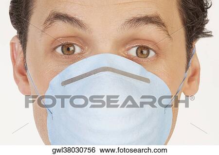 Portrait of a man wearing a flu mask View Large Photo Image Stock Photograph - Portrait of a man wearing a flu mask. Fotosearch