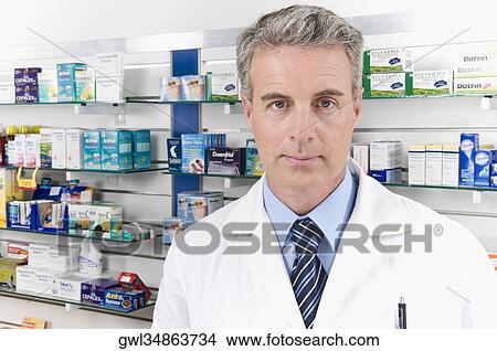 Portrait of a pharmacist in a pharmacy View Large Photo Image Picture - Portrait of a pharmacist in a pharmacy. Fotosearch