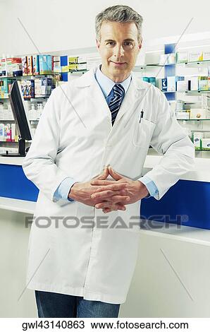 Portrait of a pharmacist in a pharmacy View Large Photo Image Stock Image - Portrait of a pharmacist in a pharmacy. Fotosearch