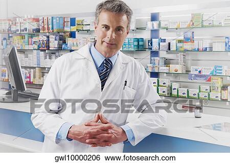 Portrait of a pharmacist in a pharmacy View Large Photo Image Stock Photograph - Portrait of a pharmacist in a pharmacy. Fotosearch