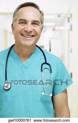 Portrait of a surgeon smiling View Large Photo Image Stock Image - Portrait of a surgeon smiling. Fotosearch