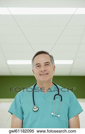 Portrait of a surgeon smiling View Large Photo Image Stock Photography - Portrait of a surgeon smiling. Fotosearch