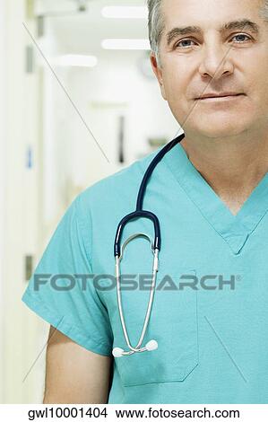 Picture - Portrait of a surgeon smirking. Fotosearch