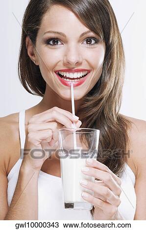 Portrait of a woman drinking milk with a straw View Large Photo Image Stock Image - Portrait of a woman drinking milk with a straw. Fotosearch