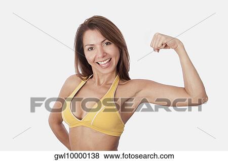 Portrait of a woman flexing muscles View Large Photo Image Stock Photo - Portrait of a woman flexing muscles. Fotosearch