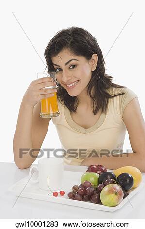 Portrait of a woman having breakfast View Large Photo Image Stock Image - Portrait of a woman having breakfast. Fotosearch
