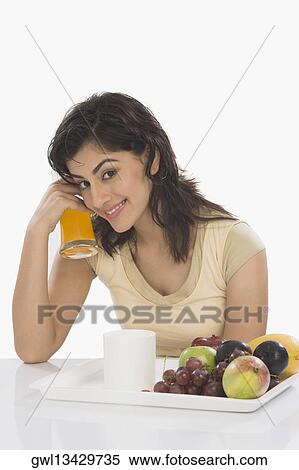 Portrait of a woman having breakfast View Large Photo Image Stock Photography - Portrait of a woman having breakfast. Fotosearch