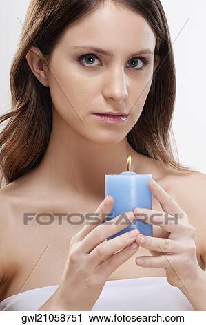 Portrait of a woman holding a candle View Large Photo Image Stock Image - Portrait of a woman holding a candle. Fotosearch