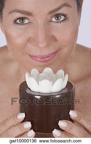Portrait of a woman holding a candle View Large Photo Image Stock Photograph - Portrait of a woman holding a candle. Fotosearch