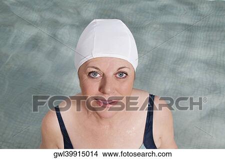 Portrait of a woman in a swimming pool View Large Photo Image Picture - Portrait of a woman in a swimming pool. Fotosearch