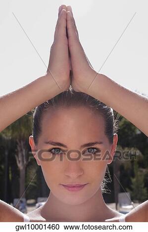 Portrait of a woman in prayer position View Large Photo Image Stock Image - Portrait of a woman in prayer position. Fotosearch