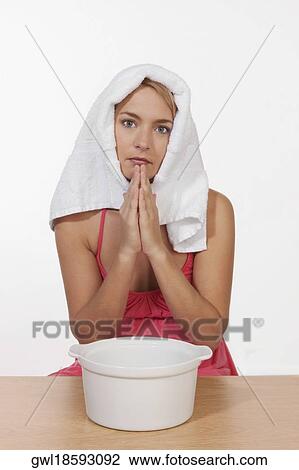 Portrait of a woman inhaling steam View Large Photo Image Stock Image - Portrait of a woman inhaling steam. Fotosearch