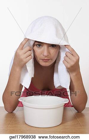 Portrait of a woman inhaling steam View Large Photo Image Stock Photo - Portrait of a woman inhaling steam. Fotosearch