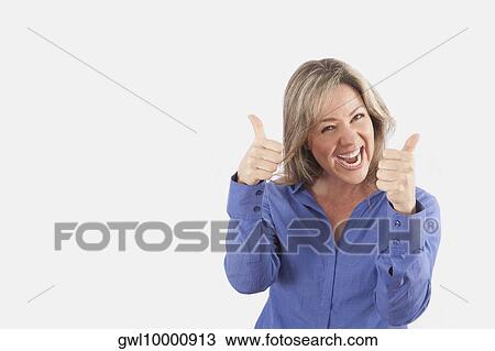 Portrait of a woman showing the thumbs up sign View Large Photo Image Stock Image - Portrait of a woman showing the thumbs up sign. Fotosearch