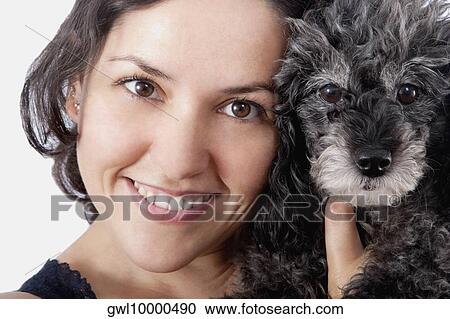 Portrait of a woman with a poodle View Large Photo Image Stock Image - Portrait of a woman with a poodle. Fotosearch