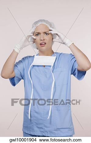 Portrait of an irritated female surgeon View Large Photo Image Picture - Portrait of an irritated female surgeon. Fotosearch