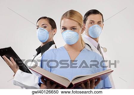 Portrait of doctors wearing flu masks View Large Photo Image Stock Image - Portrait of doctors wearing flu masks. Fotosearch