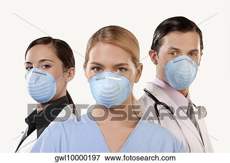 Portrait of doctors wearing flu masks View Large Photo Image Stock Photo - Portrait of doctors wearing flu masks. Fotosearch