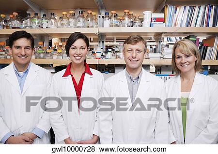 Portrait of four doctors smiling in a laboratory View Large Photo Image Stock Photo - Portrait of four doctors smiling in a laboratory. Fotosearch