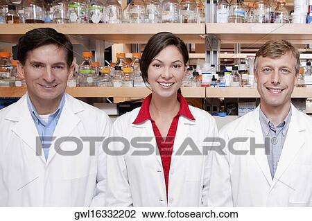 Portrait of three doctors smiling in a laboratory View Large Photo Image Stock Image - Portrait of three doctors smiling in a laboratory. Fotosearch