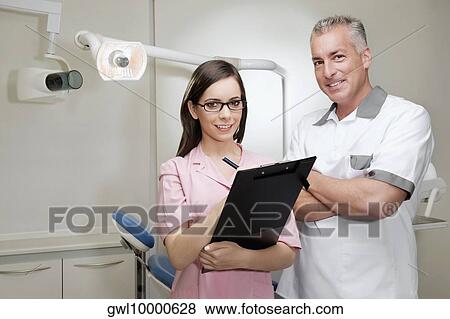 Portrait of two dentists smiling View Large Photo Image Stock Photo - Portrait of two dentists smiling. Fotosearch