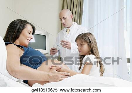 Pregnant woman in a hospital with her daughter View Large Photo Image Stock Photography - Pregnant woman in a hospital with her daughter. Fotosearch
