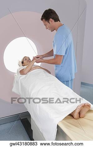 Surgeon talking with a patient View Large Photo Image Stock Image - Surgeon talking with a patient. Fotosearch