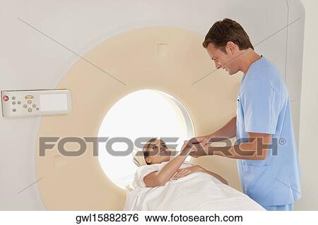 Surgeon talking with a patient View Large Photo Image Stock Photograph - Surgeon talking with a patient. Fotosearch