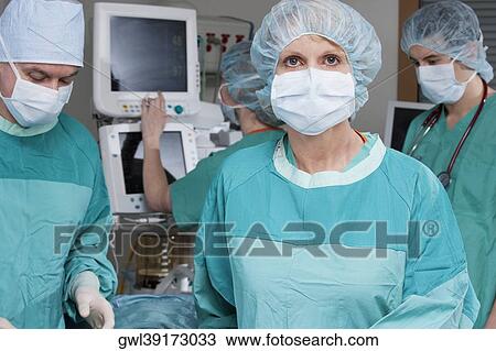Surgeons in an operating room View Large Photo Image Stock Image - Surgeons in an operating room. Fotosearch