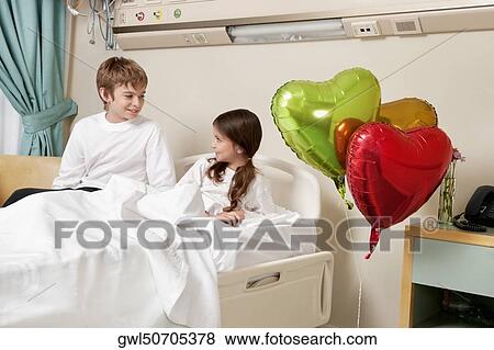 Two children in a hospital ward View Large Photo Image Stock Photo - Two children in a hospital ward. Fotosearch