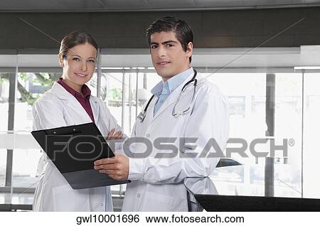Two doctors in a hospital View Large Photo Image Stock Photograph - Two doctors in a hospital. Fotosearch