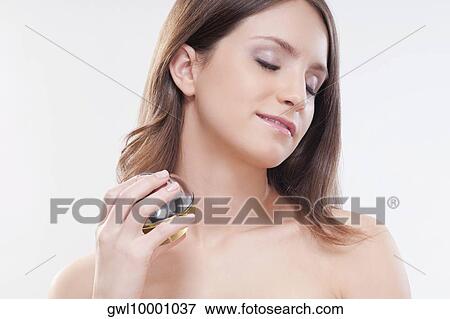Woman applying aromatherapy oil View Large Photo Image Stock Photo - Woman applying aromatherapy oil. Fotosearch