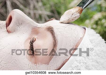 Woman applying face pack View Large Photo Image Stock Photo - Woman applying face pack. Fotosearch