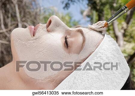 Woman applying face pack View Large Photo Image Stock Photography - Woman applying face pack. Fotosearch