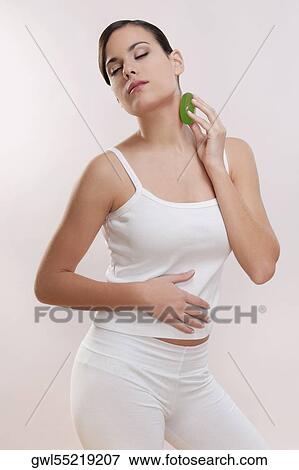 Woman applying soap on her neck View Large Photo Image Stock Photo - Woman applying soap on her neck. Fotosearch