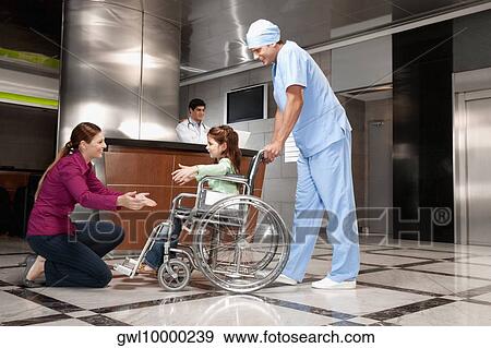 Woman assisting her daughter to walk View Large Photo Image Stock Photo - Woman assisting her daughter to walk. Fotosearch