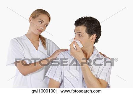 Woman beside a man suffering from cold View Large Photo Image Stock Image - Woman beside a man suffering from cold. Fotosearch