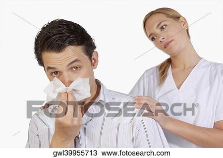 Woman beside a man suffering from cold View Large Photo Image Stock Image - Woman beside a man suffering from cold. Fotosearch