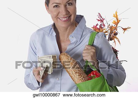 Woman carrying a bag of groceries View Large Photo Image Stock Photo - Woman carrying a bag of groceries. Fotosearch