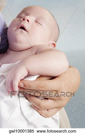 Woman carrying her newborn baby View Large Photo Image Stock Photography - Woman carrying her newborn baby. Fotosearch