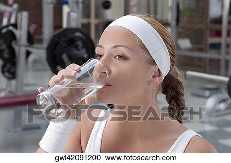 Stock Image - Woman drinking water. Fotosearch