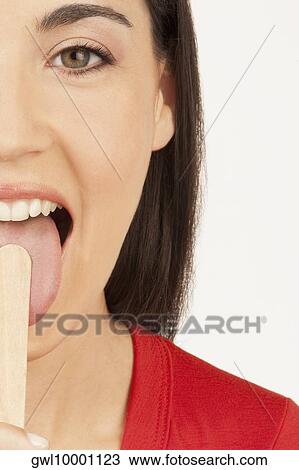 Woman examining her tongue View Large Photo Image Stock Image - Woman examining her tongue. Fotosearch