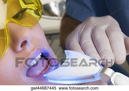 Woman having a dental exam View Large Photo Image Stock Photography - Woman having a dental exam. Fotosearch