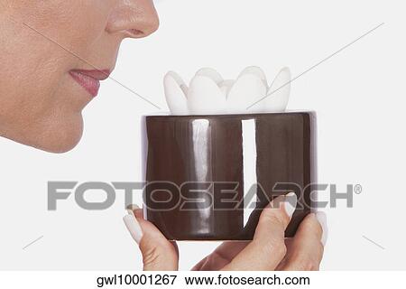 Woman holding an aromatic candle View Large Photo Image Stock Photo - Woman holding an aromatic candle. Fotosearch