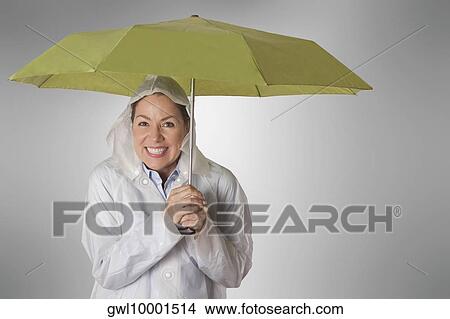Picture - Woman holding an umbrella. Fotosearch