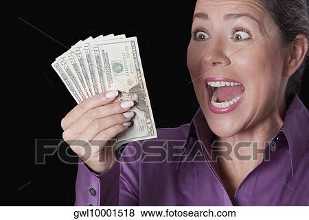 Woman holding currency notes and shouting View Large Photo Image Stock Photo - Woman holding currency notes and shouting. Fotosearch