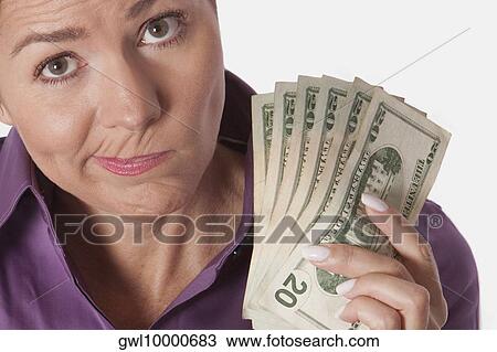 Woman holding currency notes View Large Photo Image Stock Image - Woman holding currency notes. Fotosearch